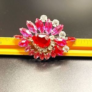 Vintage Starburst Brooch. Pink red and white stones. Very sparkly.